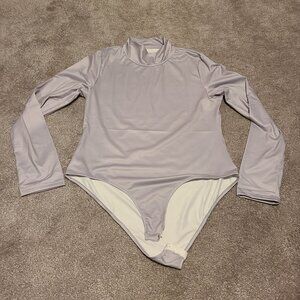 NWOT Stretchy Light grey long sleeve body suit with turtleneck